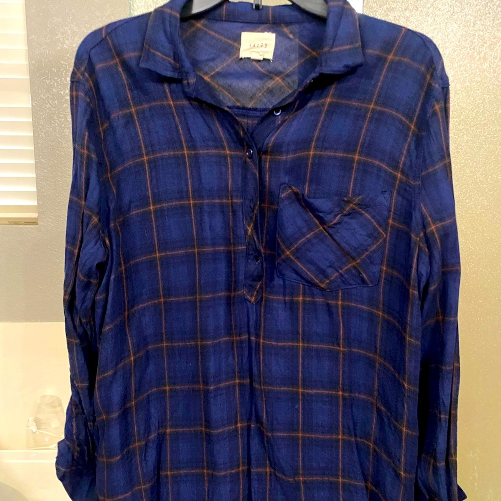 Plaid, half button, pull over top.